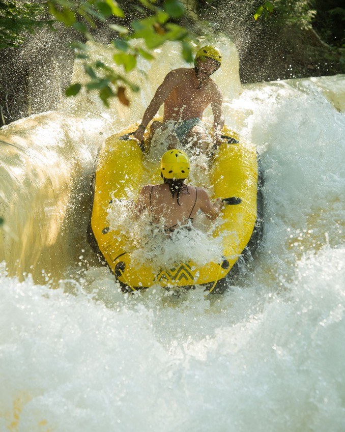 Rafting down a water slide at Sommet Saint-Sauveur