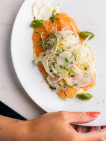 A plated dish with vegetables and herbs