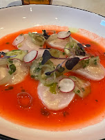 A dish served in a vivid red sauce