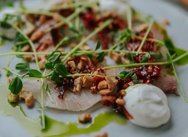 A plated dish with fresh herbs