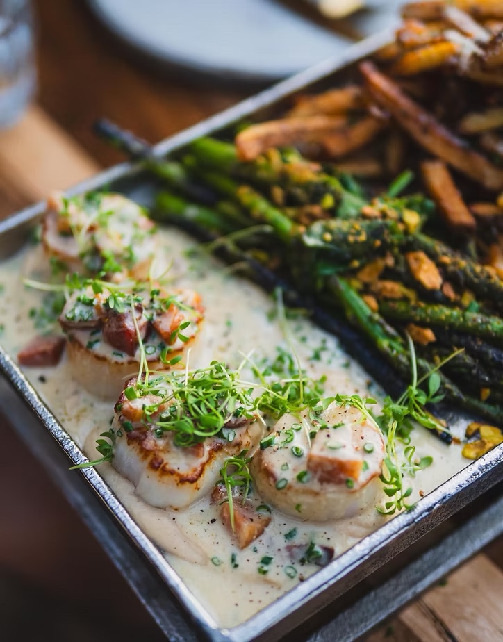 Scallops served with vegetables