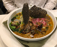 A savoury bowl with crisp garnish
