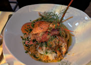 A seafood dish with fresh herbs