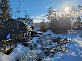 Snowy river beside the spa buildings